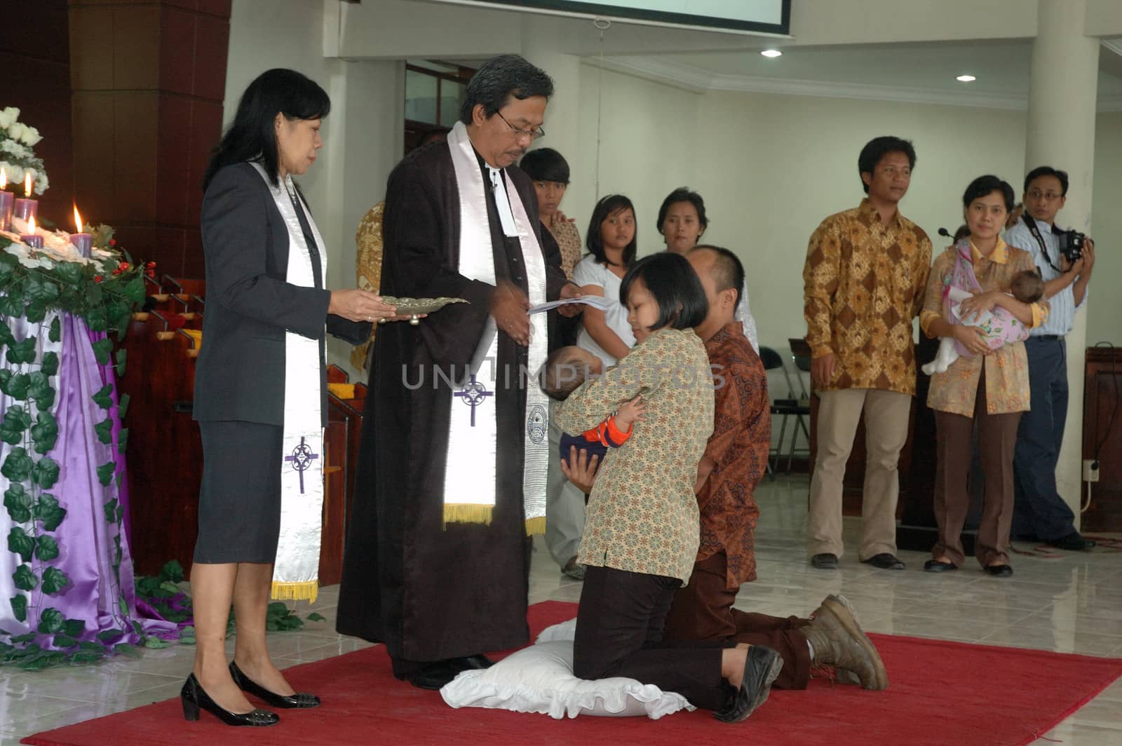 bandung, indonesia-december 19, 2010: Baptism - a christian rite of admission and almost invariably with the use of water, into the christian church generally and also a particular church tradition.