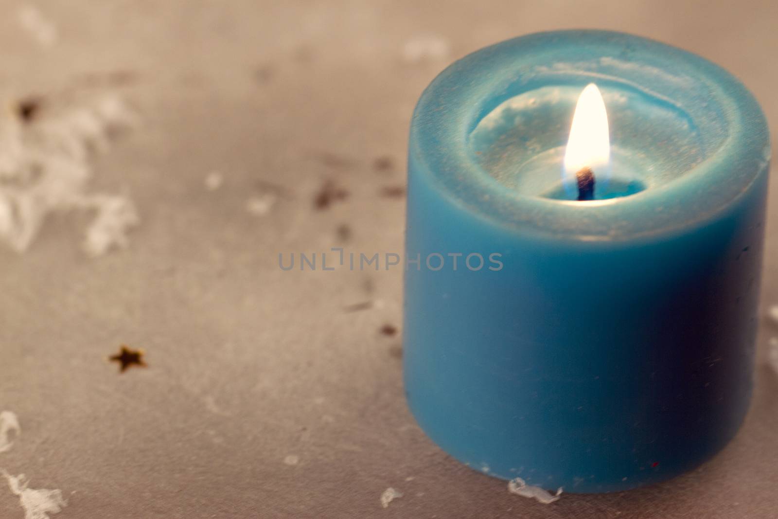 Christmas candles with evergreen decorations and snow