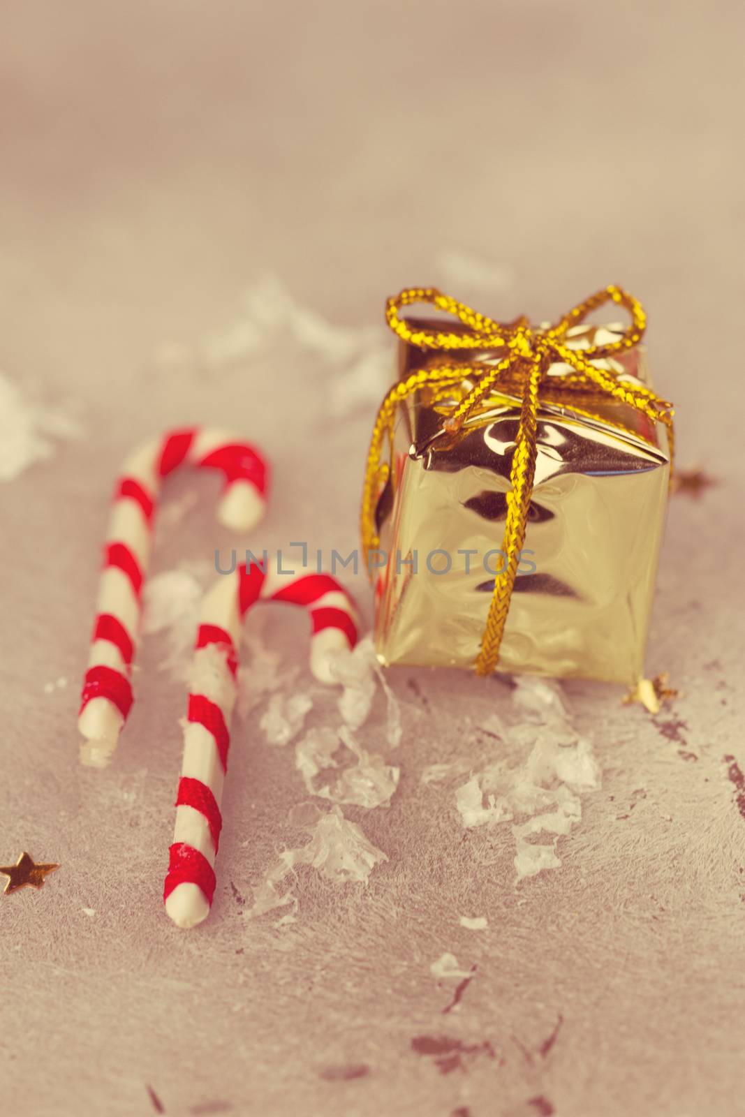 Christmas holiday candy sticks on snowy background