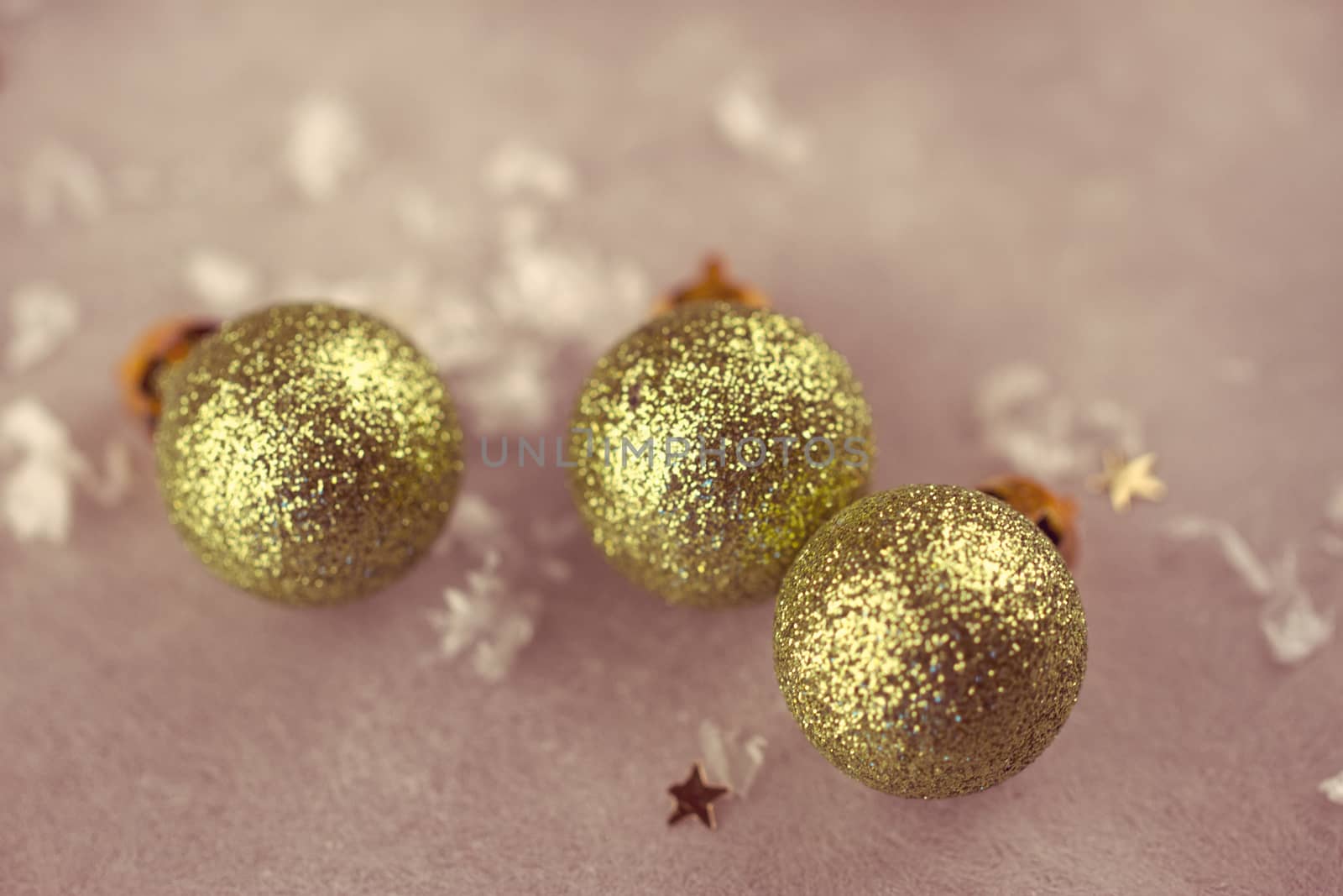 green christmas bauble on artificial snow with white background