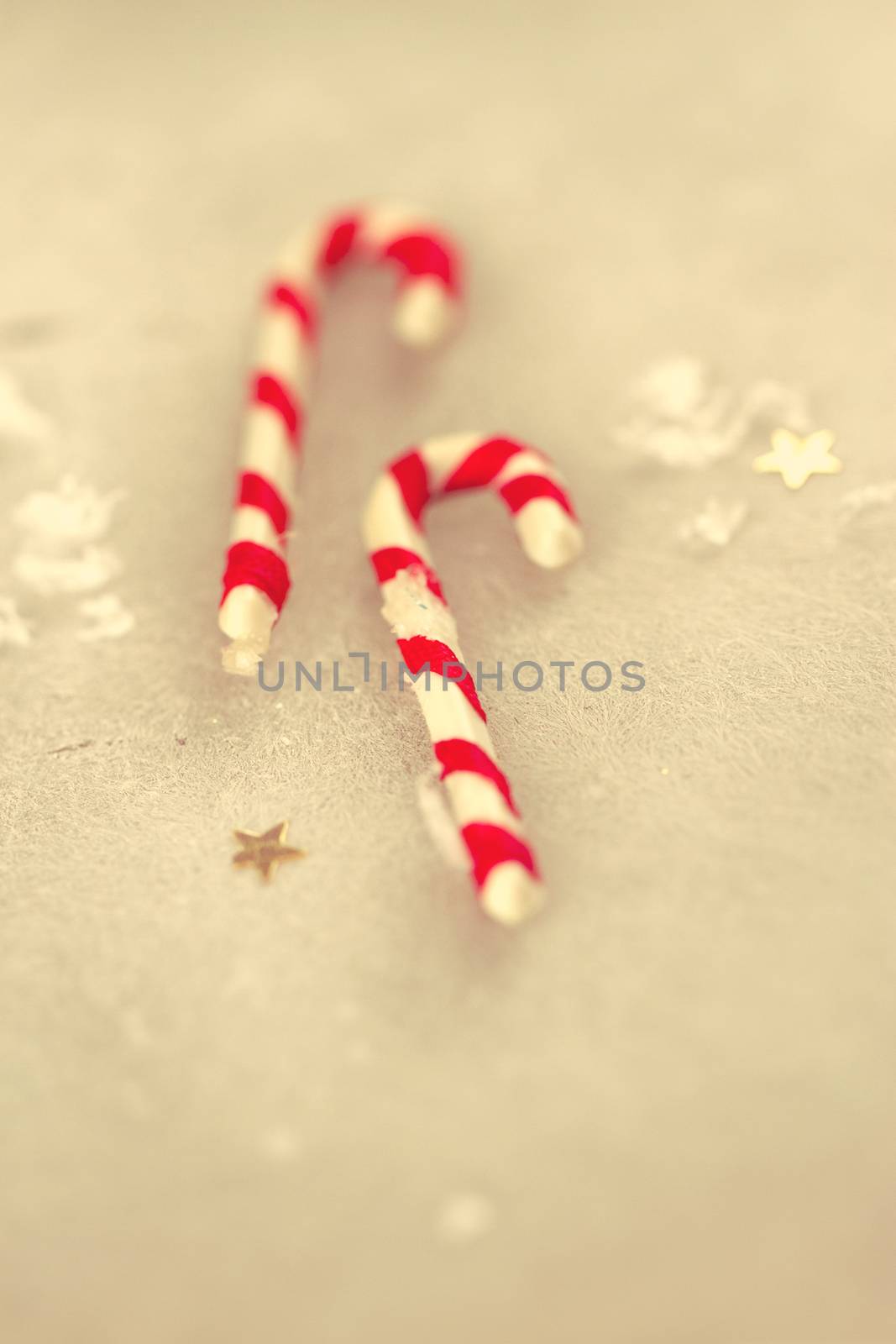 Christmas holiday candy sticks on snowy background