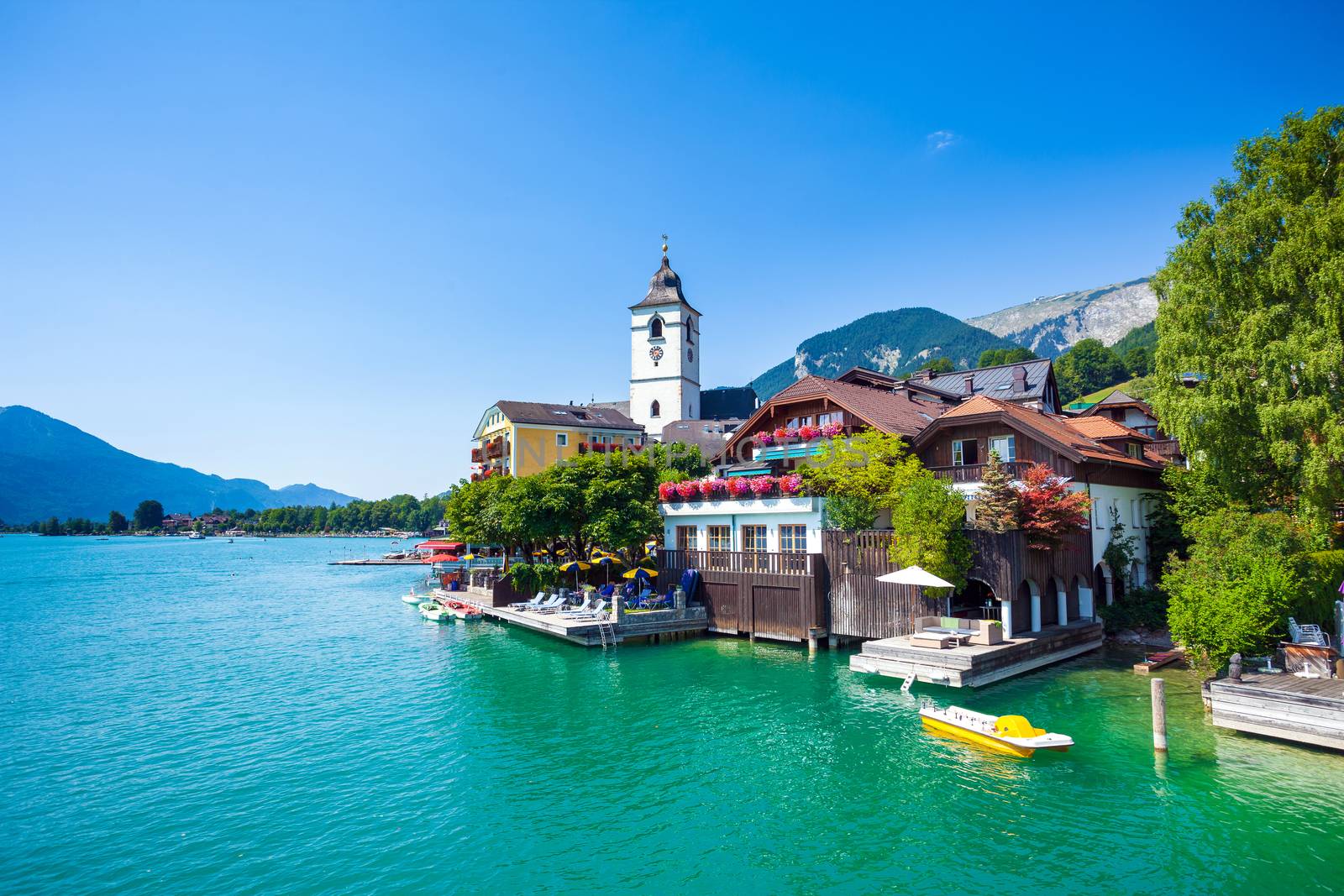 View of View of St. Wolfgang chapel and the village waterfront at Wolfgangsee lake, Austria