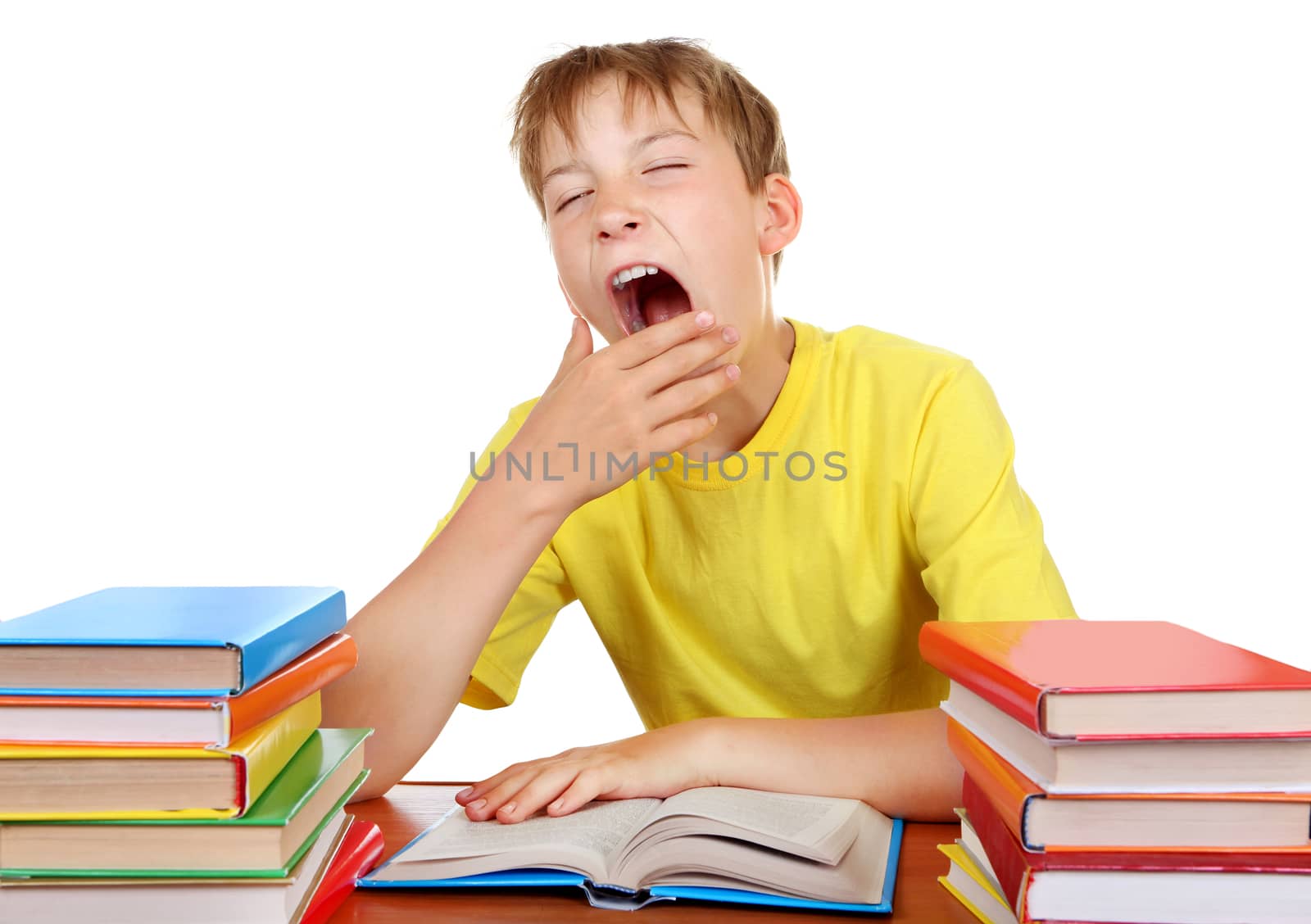 Tired Schoolboy yawning by sabphoto