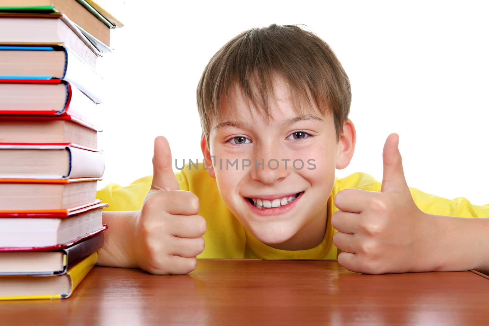 Cheerful Kid with a Books and OK Gesture on the White Background