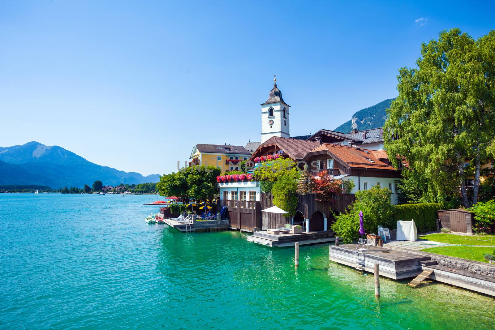 View of View of St. Wolfgang chapel and the village waterfront at Wolfgangsee lake, Austria