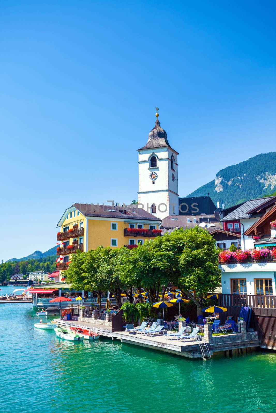 View of View of St. Wolfgang chapel and the village waterfront at Wolfgangsee lake, Austria