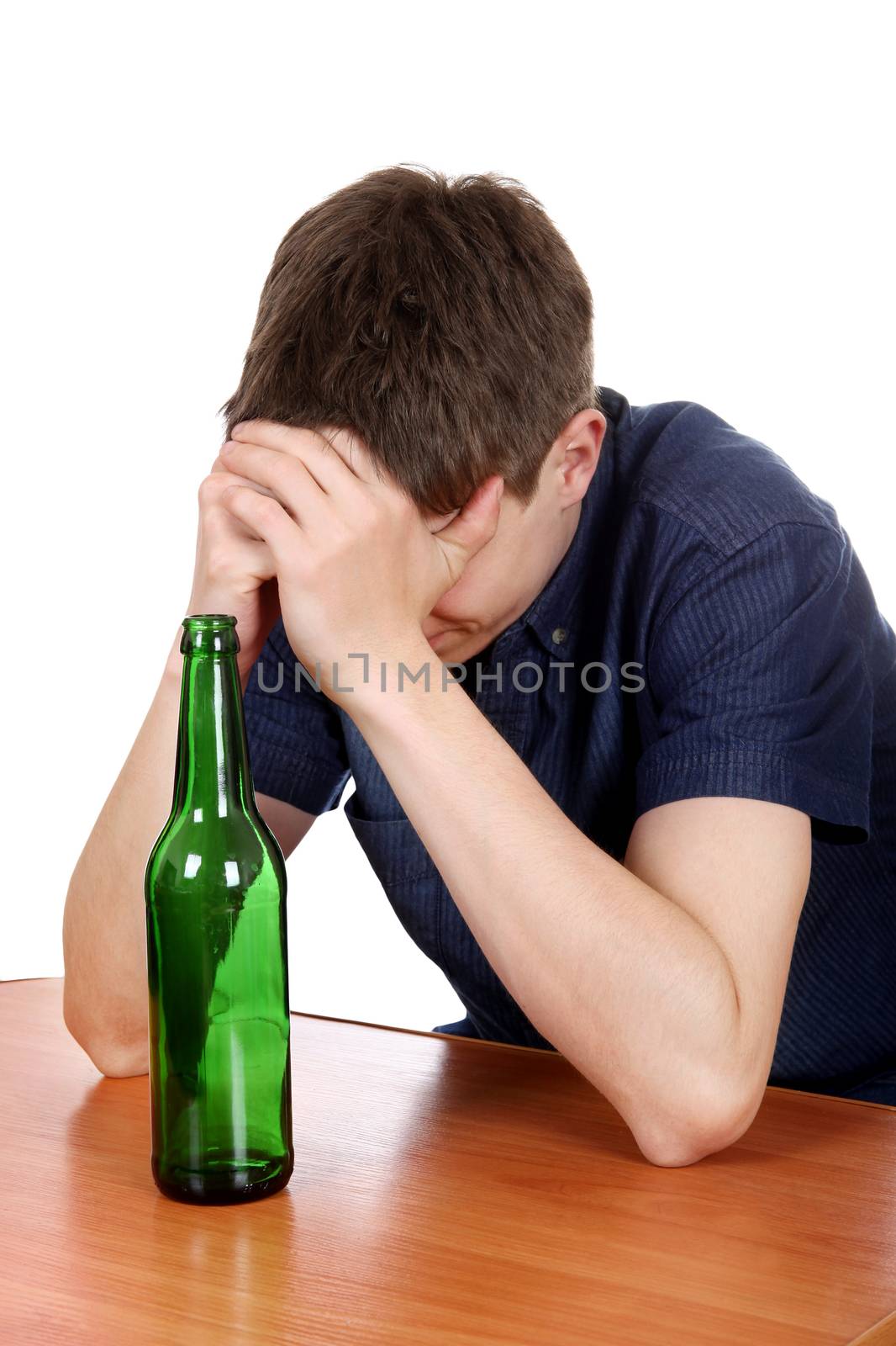 Sad and Depressed Man in Alcohol addiction on Desk Isolated on the White Background