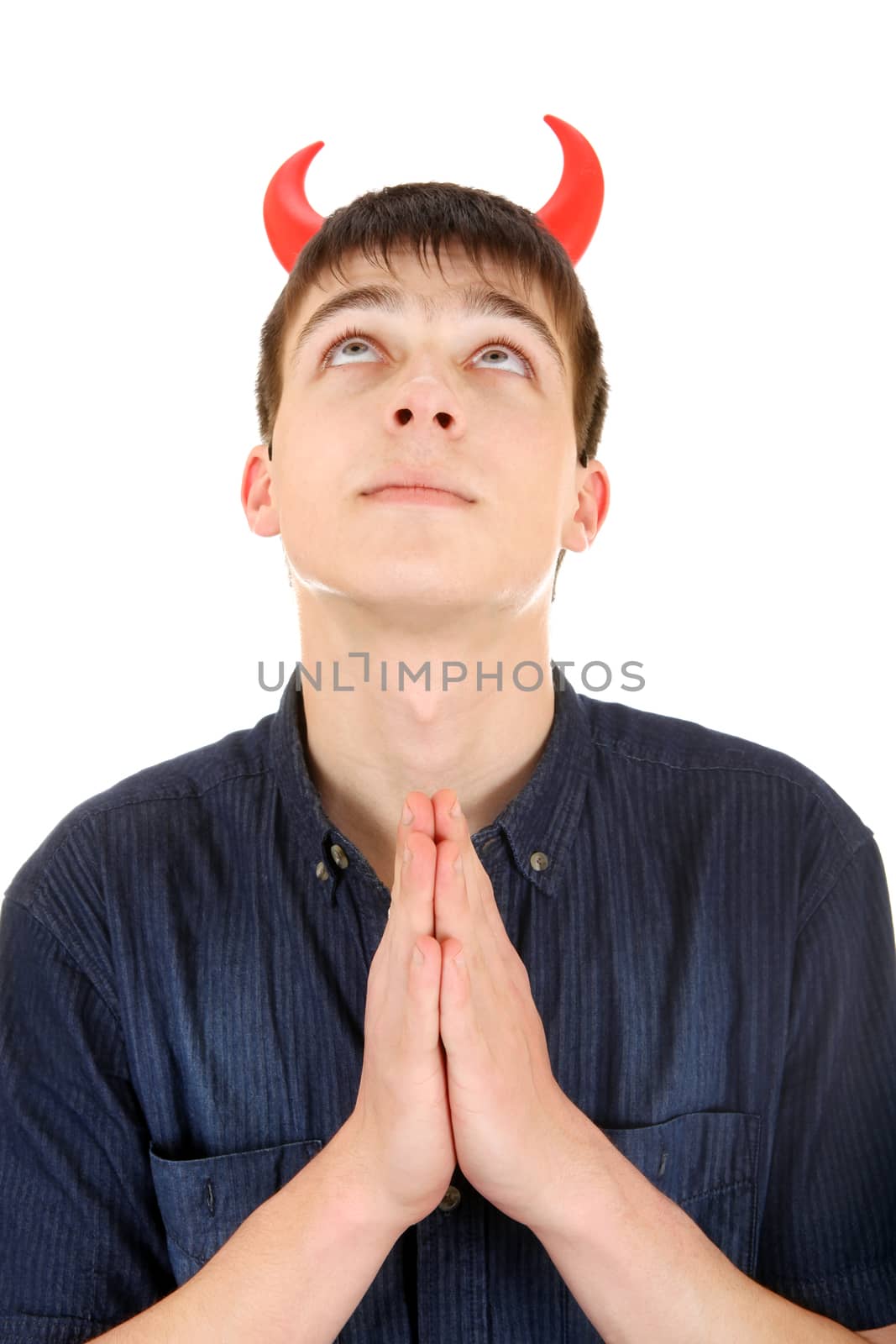 Teenager with Devil Horns is Praying Isolated on the White Background