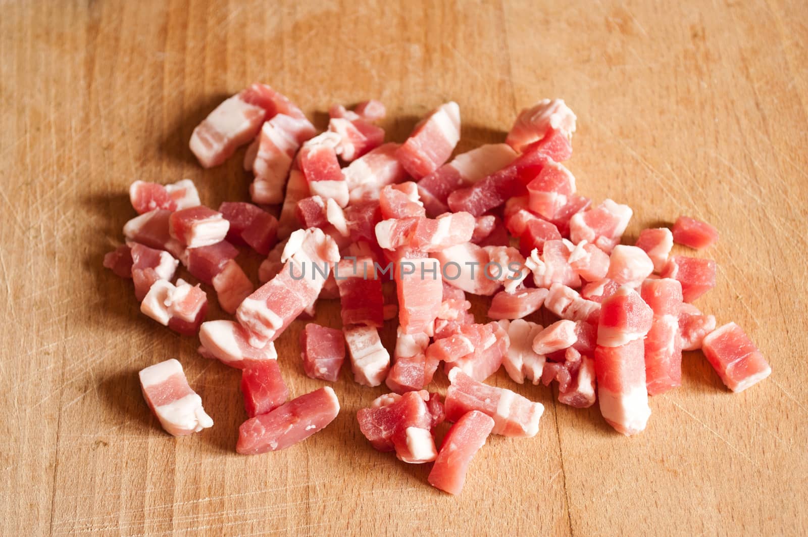 Bacon cubes on wooden board