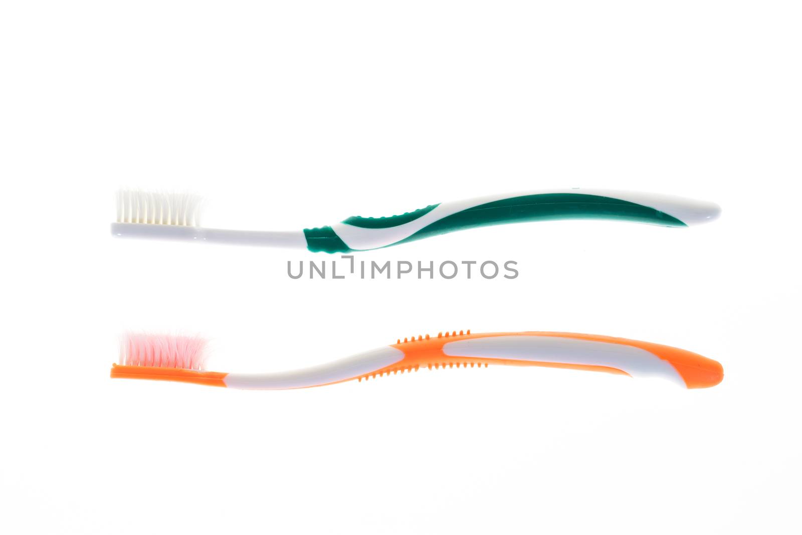 Two Color worn toothbrush on isolated white background by iamway