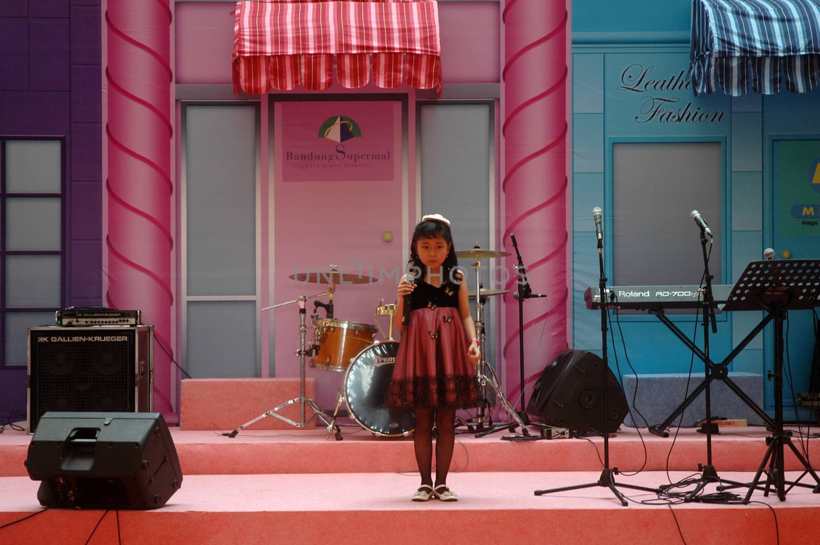 bandung, indonesia-december 17, 2011: girl contestant at bandung supermall singing contest.