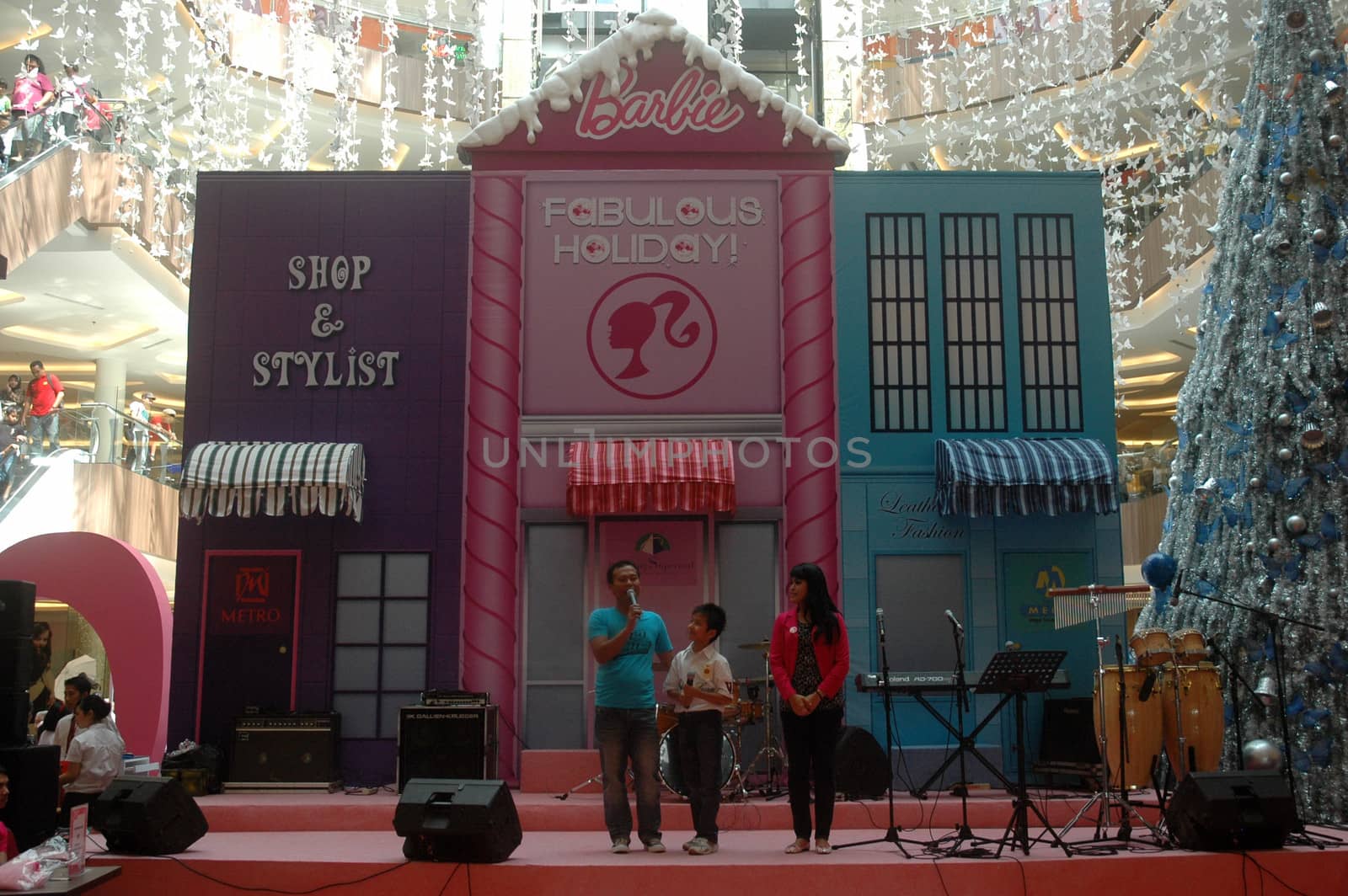 bandung, indonesia-december 17, 2011: boy contestant at bandung supermall singing contest.