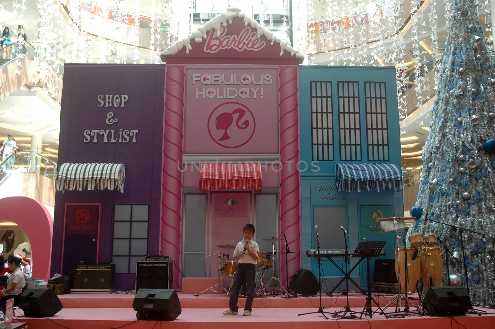 bandung, indonesia-december 17, 2011: boy contestant at bandung supermall singing contest.