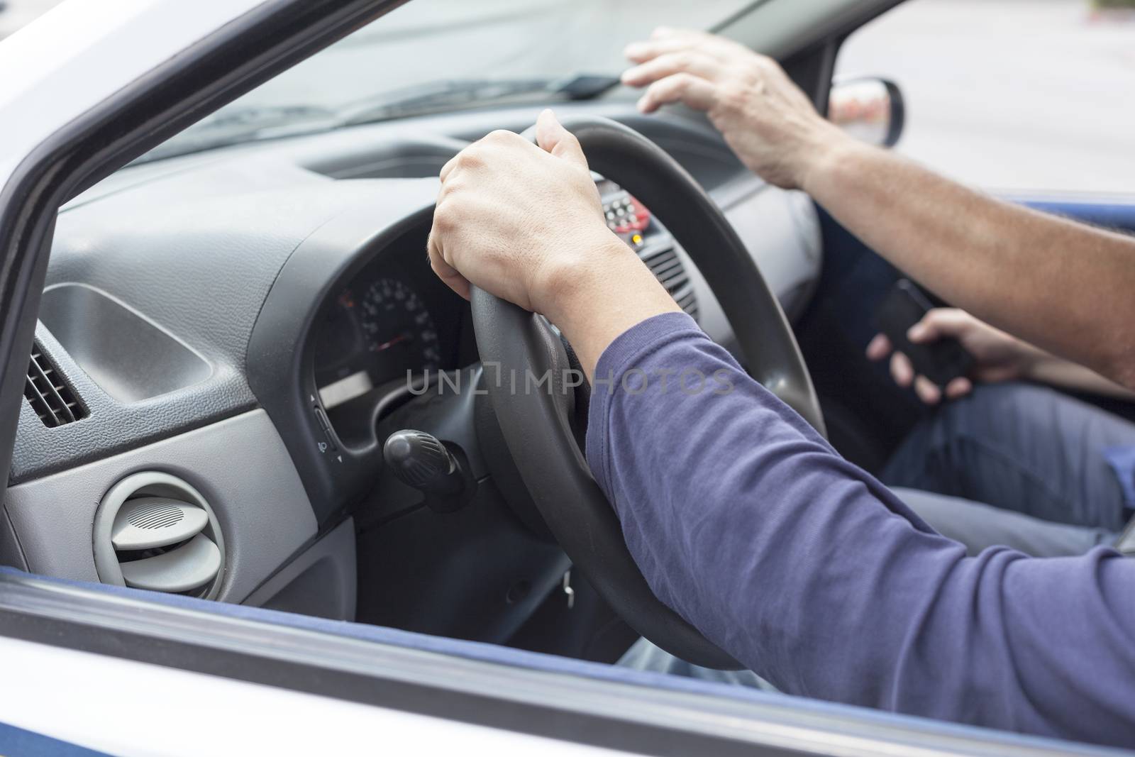 Close up of woman's hand driving a car