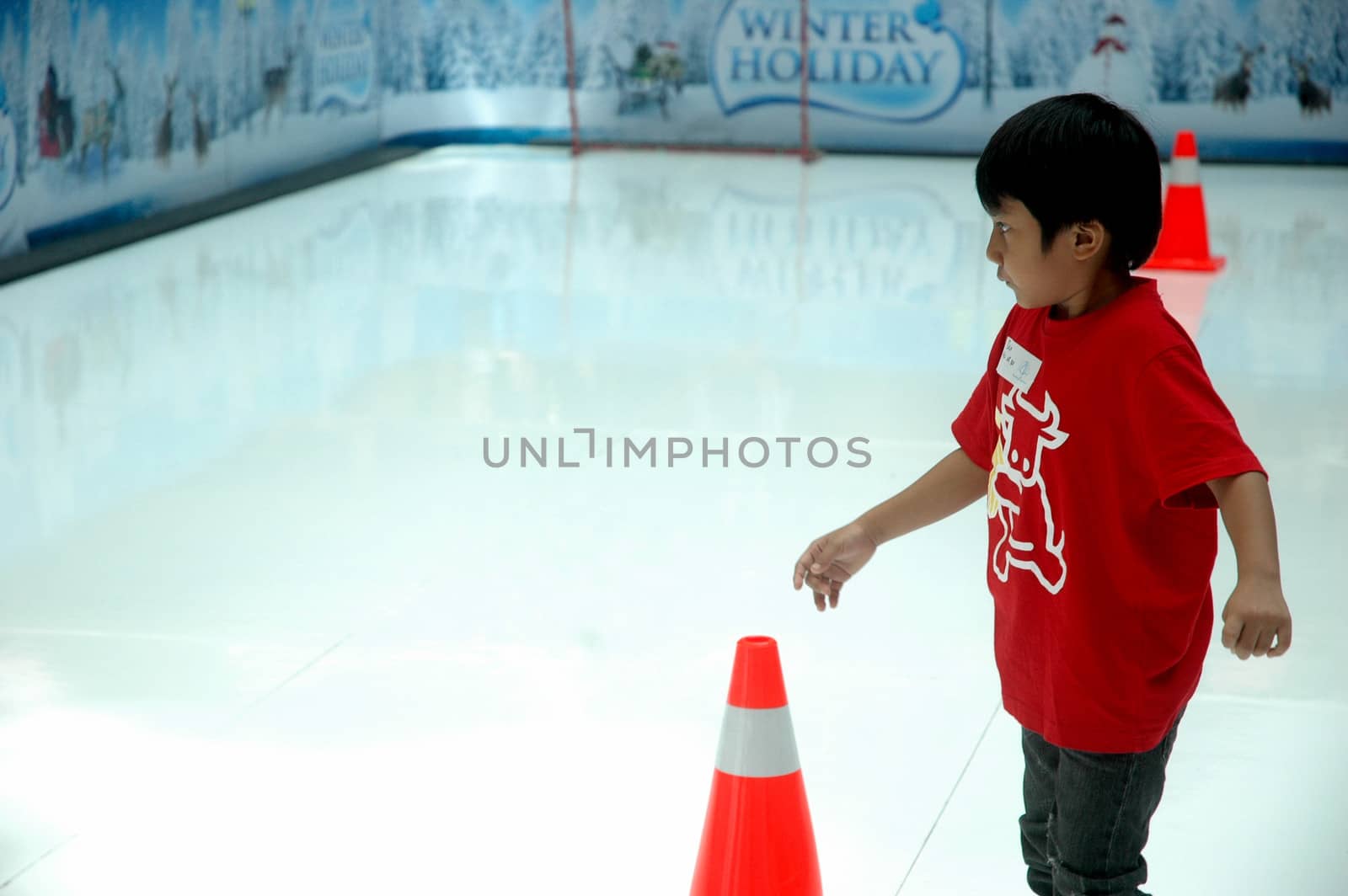 bandung, indonesia-december 17, 2011: boy learning inline skate at bandung supermall venue.