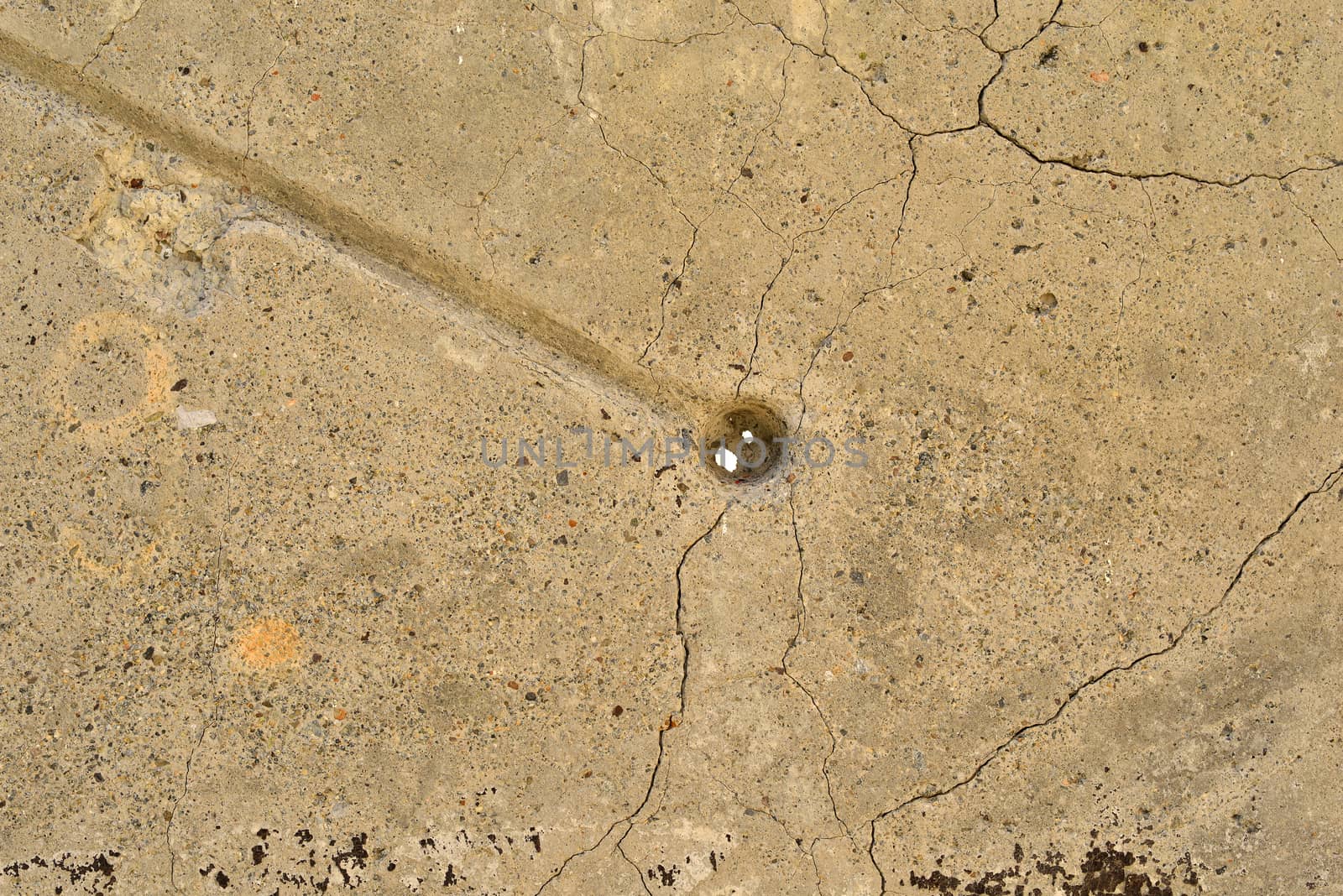 The old, cracked concrete surface. Close up