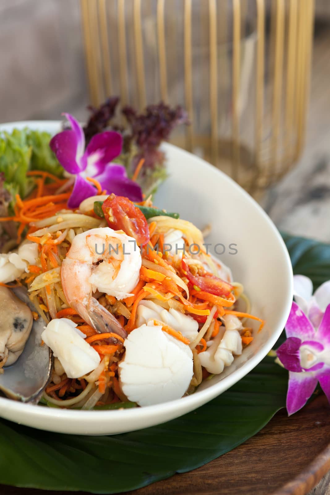 Traditional dish of freshly prepared Thai food.  Thai seafood and som tum green papaya salad.