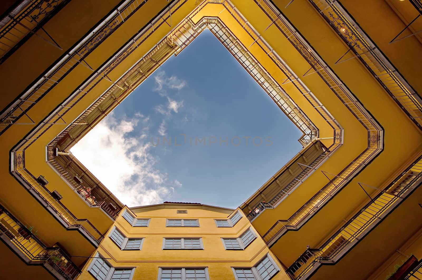 Leveles of an yellow  building by anderm