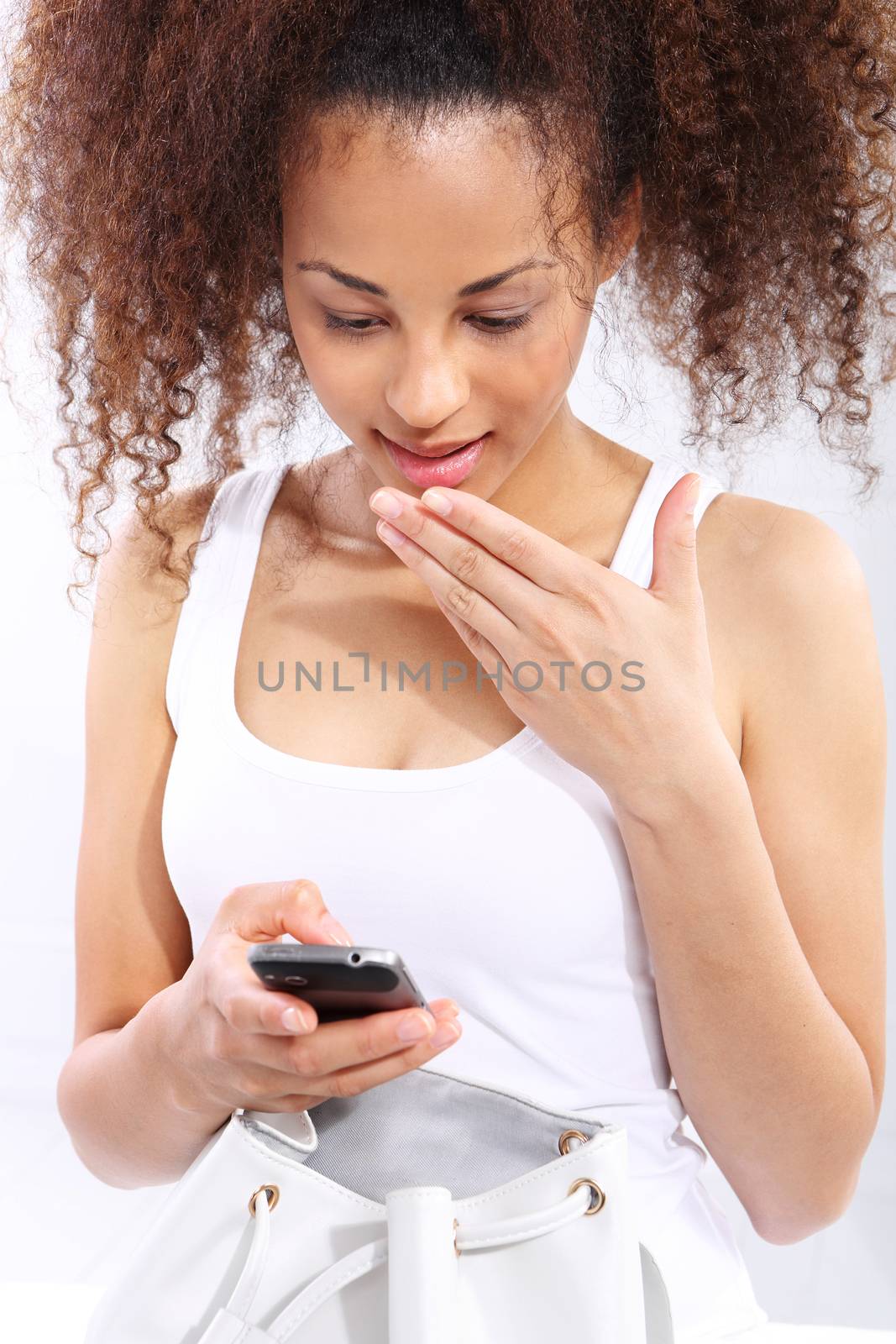 Good news - dark skinned girl reads sms by robert_przybysz