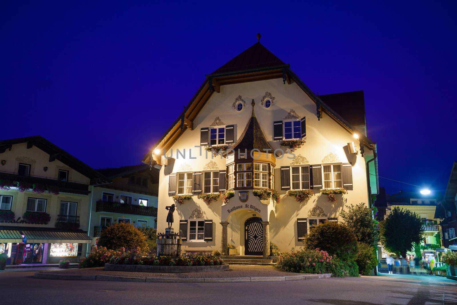 Statue of Mozart and townhall at night on Mozartplatz in St. Gilgen, Austria