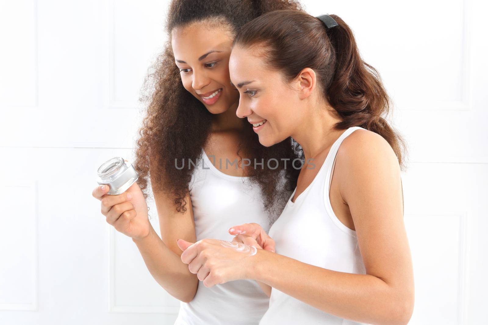 Happy women analyzes the composition of the cream.