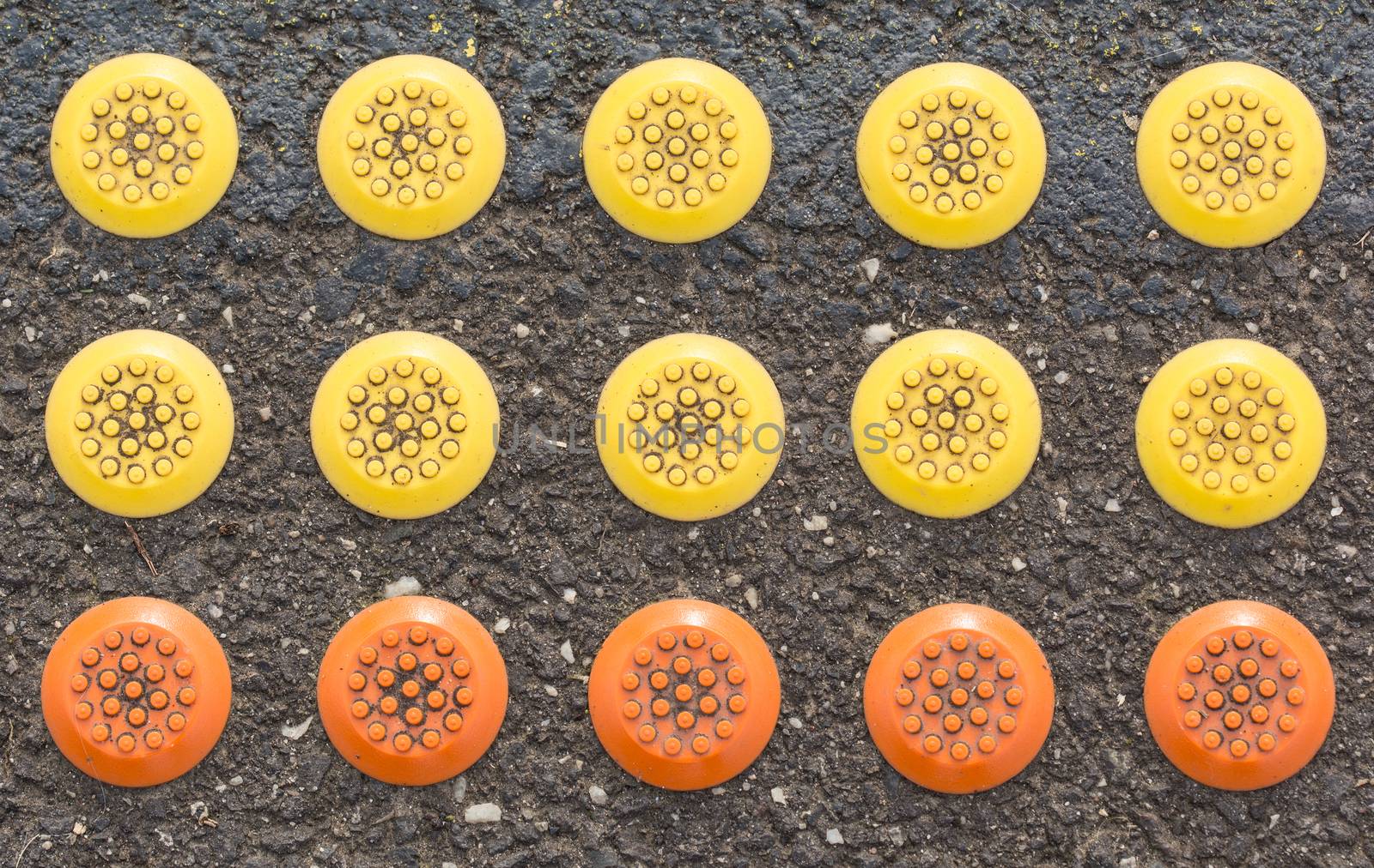 mixed rubber button color on the ground at the train station