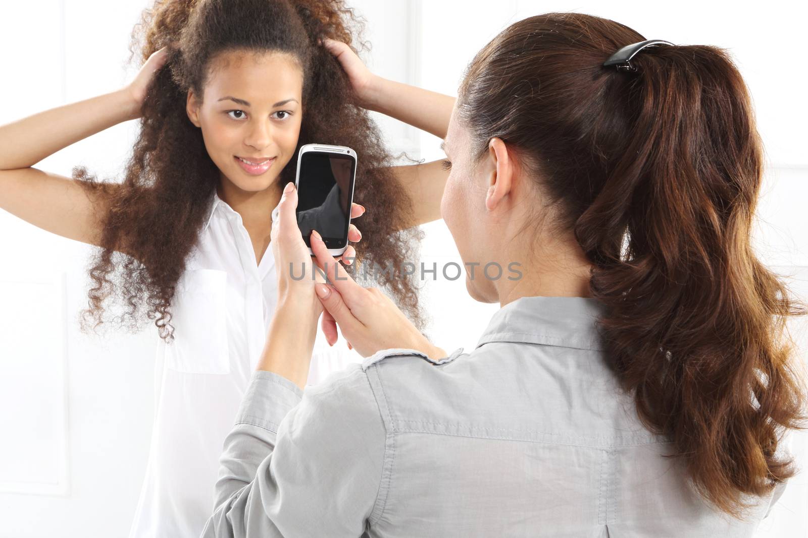 Two women with mobile phone