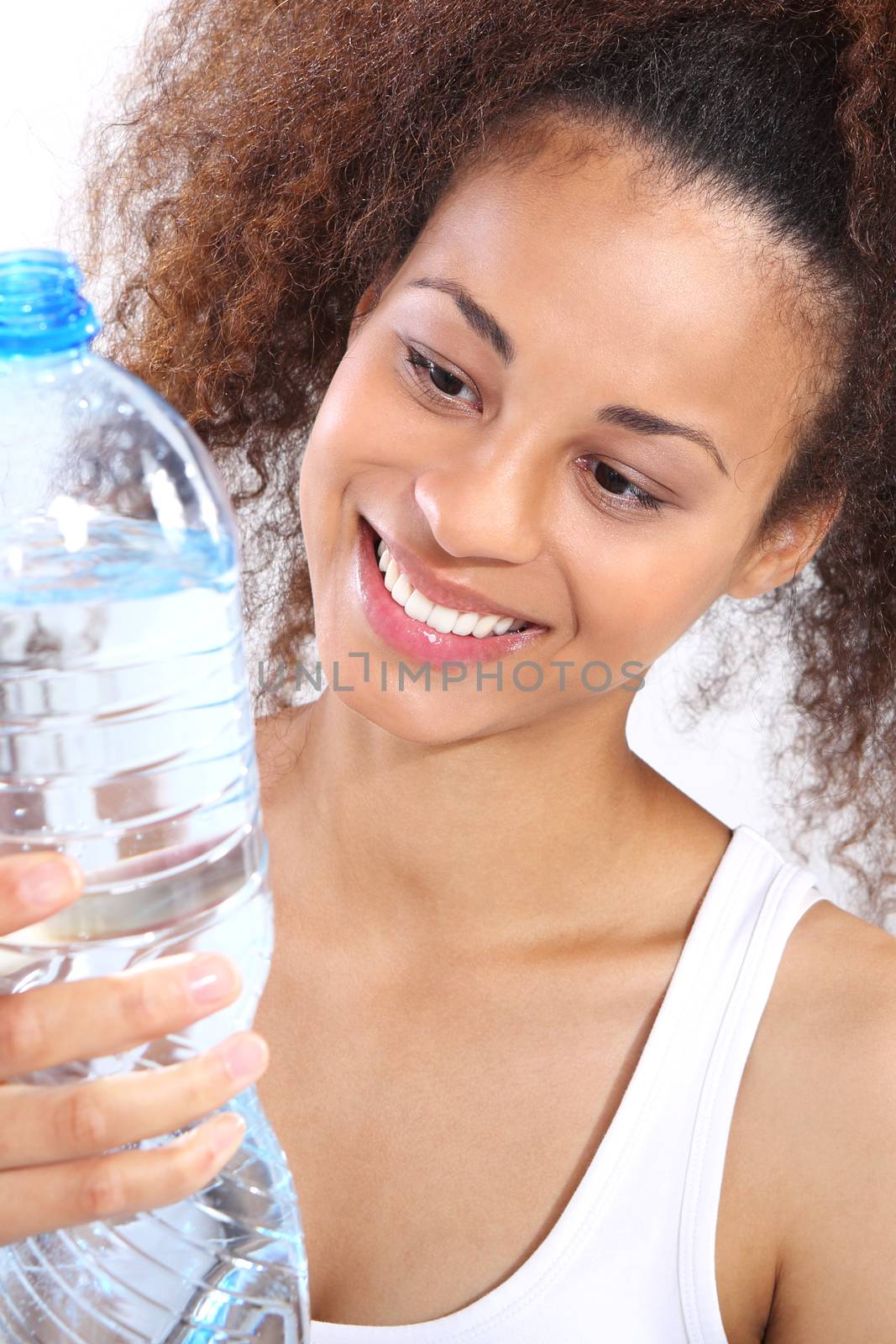 Mineral water, dark skinned girl with bottle of water