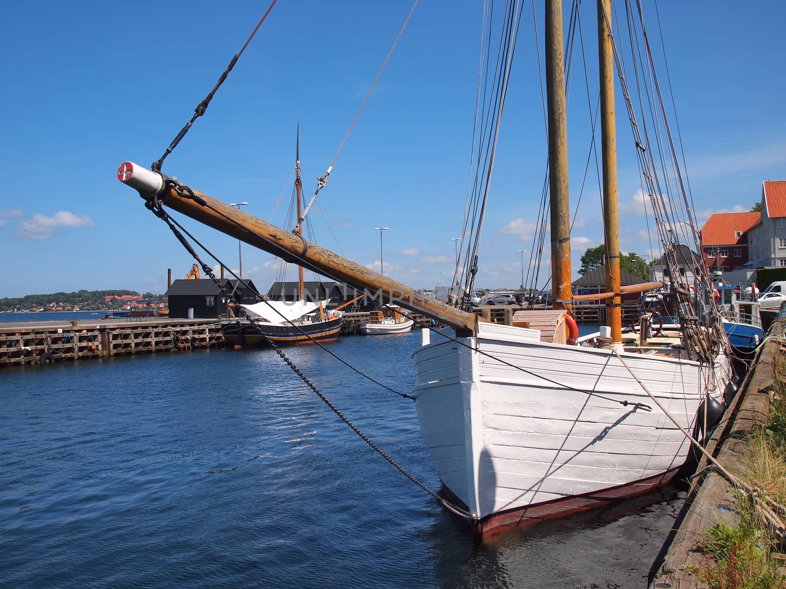 Old vintage traditional wooden sail boat in Middelfart Marina Denmark