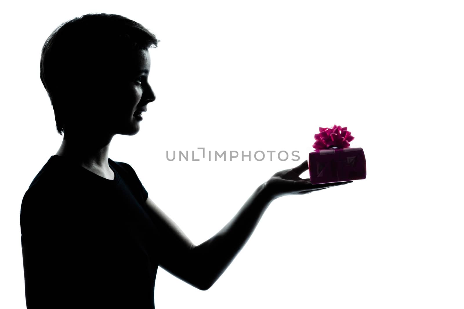 one  young teenager silhouette girl offering present gift portrait in studio cut out isolated on white background
