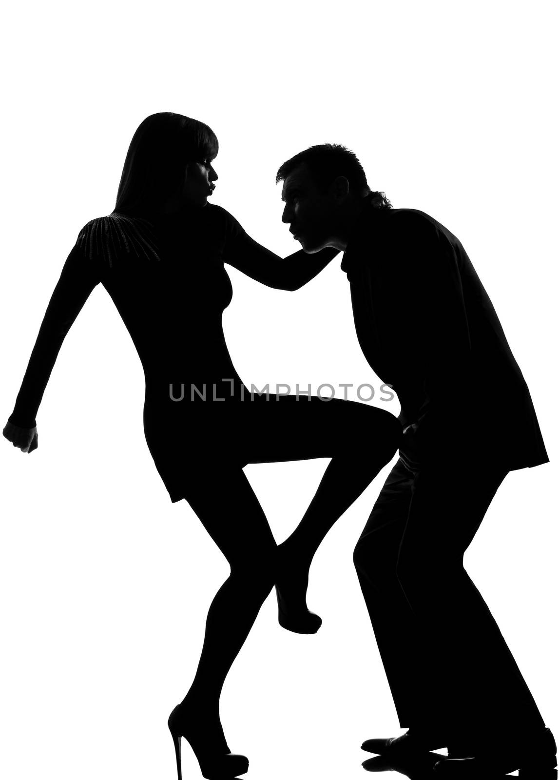 one  couple man and woman self defense domestic violence in studio silhouette isolated on white background