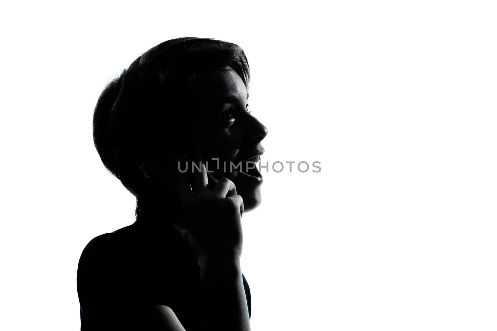 one  young teenager silhouette boy or girl on the telephone portrait in studio cut out isolated on white background