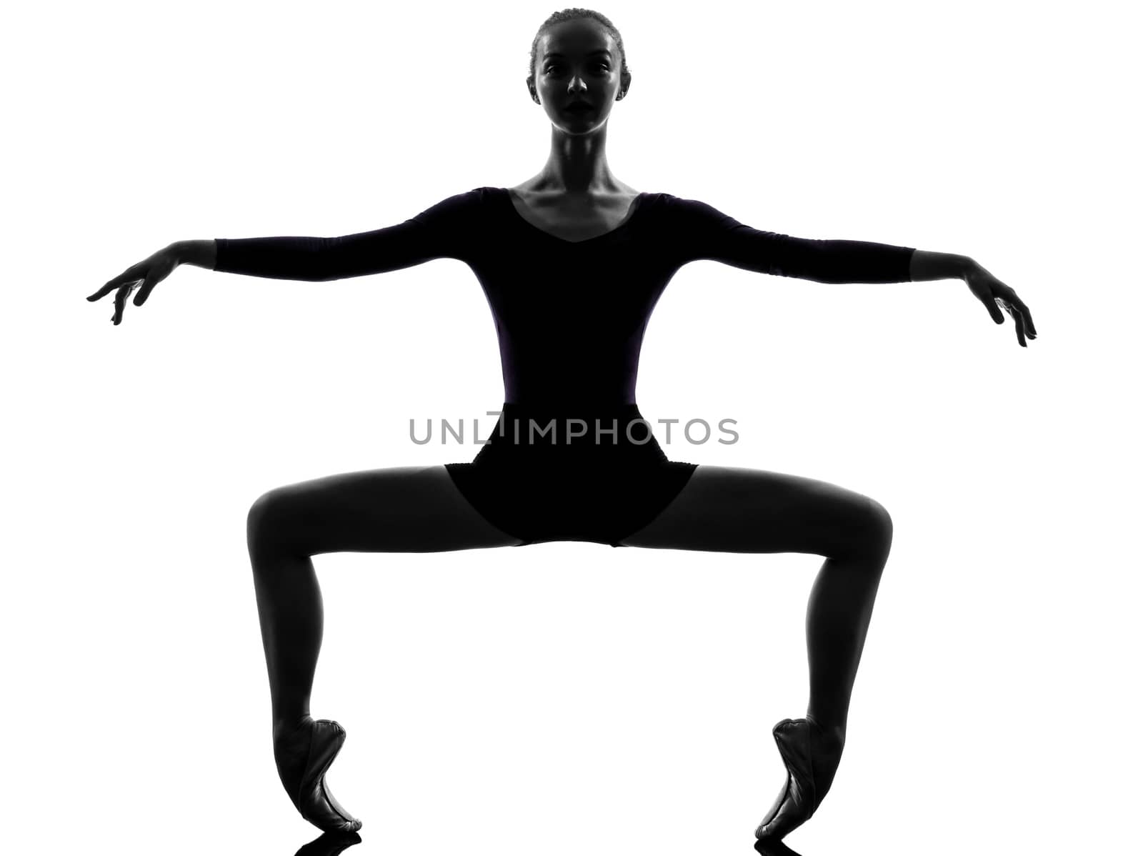 one  young woman ballerina ballet dancer stretching warming up in silhouette studio on white background