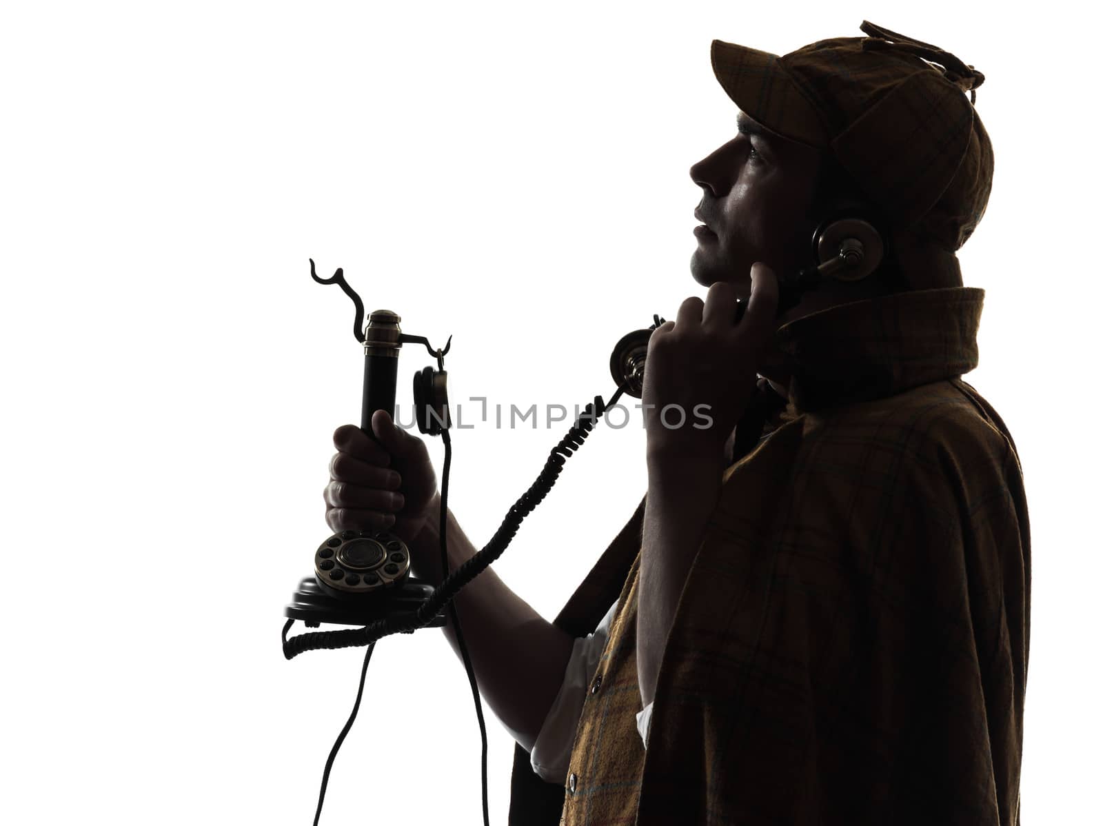 sherlock holmes silhouette on the phone in studio on white background