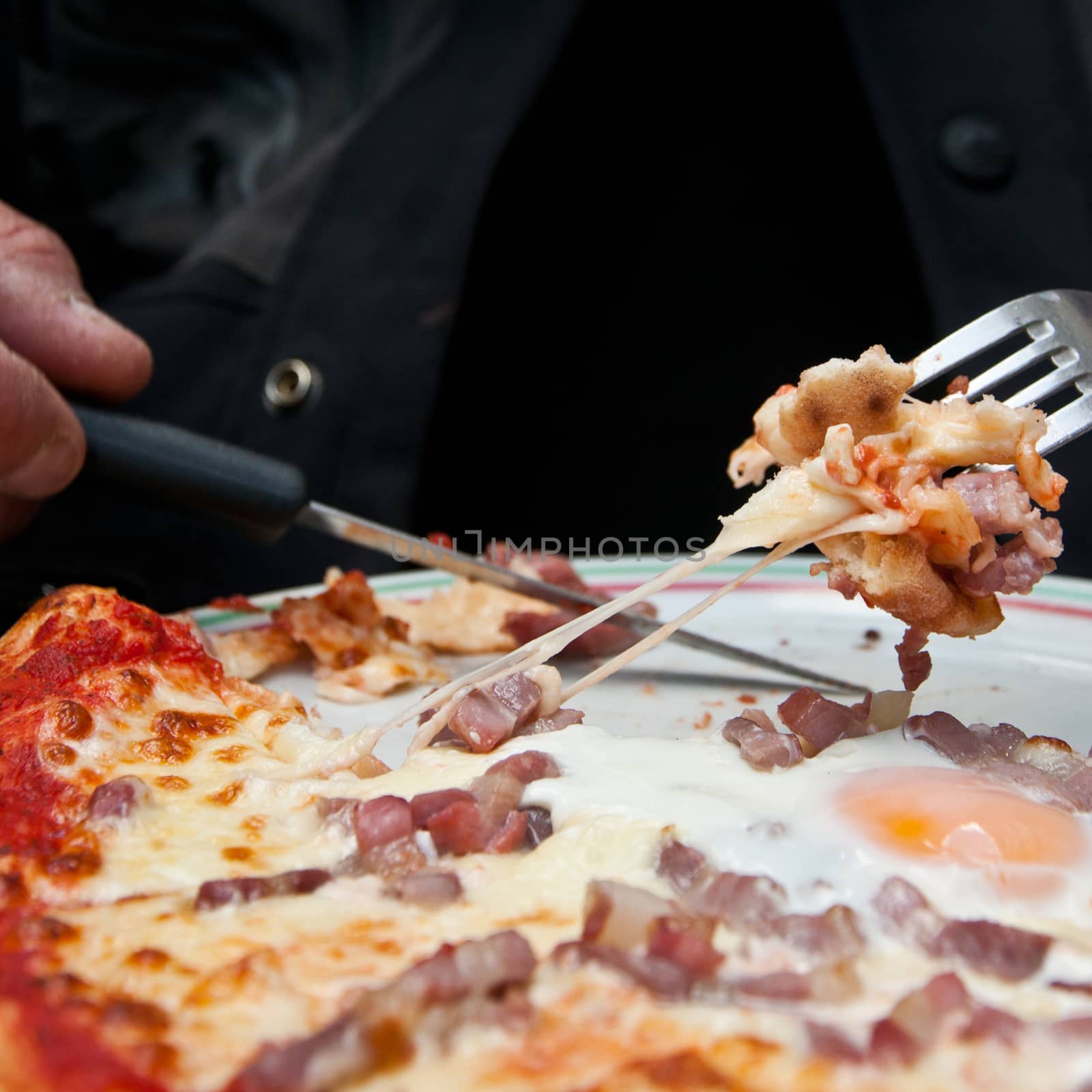 pizza with bacon and eggs eating