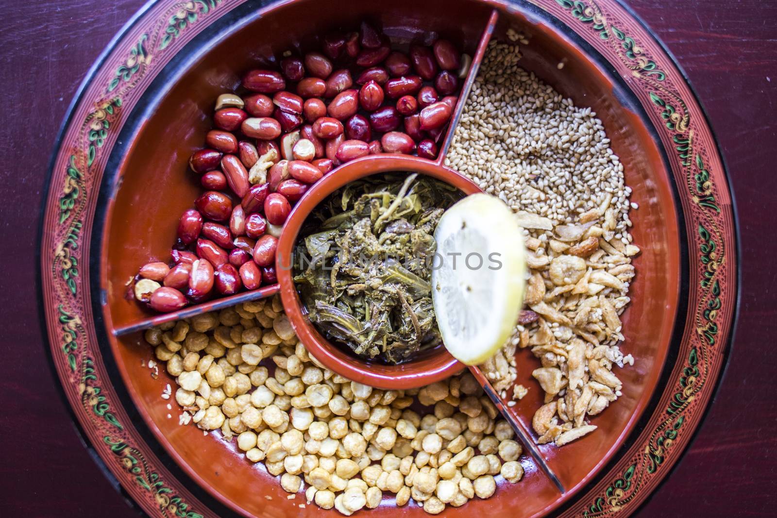 A selection of typical Myanmar snacks: tasty and spicy seeds, nuts and pickled tea leaves.