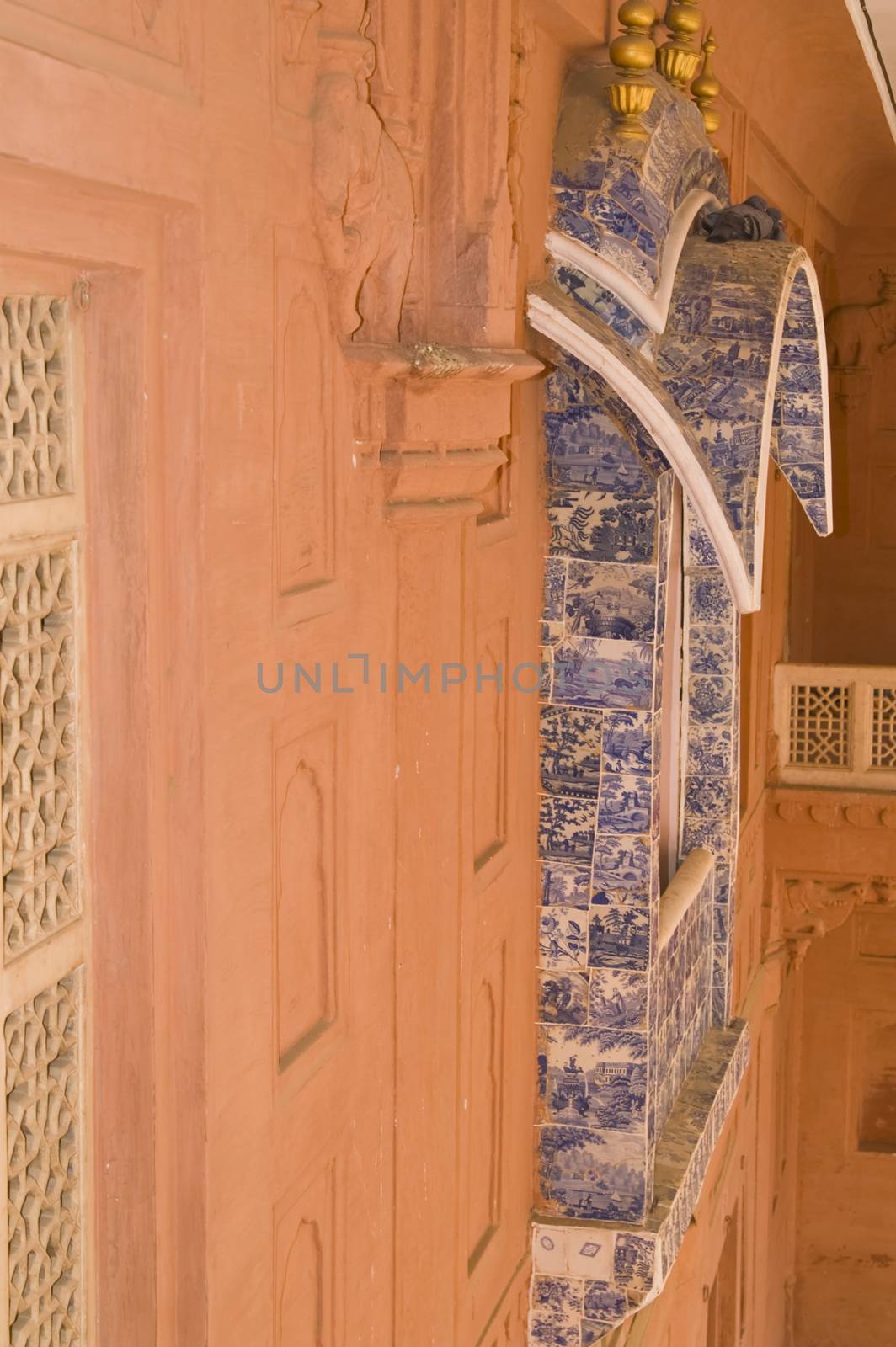 Ornate window decorated with Delft Tiles inside Junagarh Fort in Bikaner, Rajasthan, India