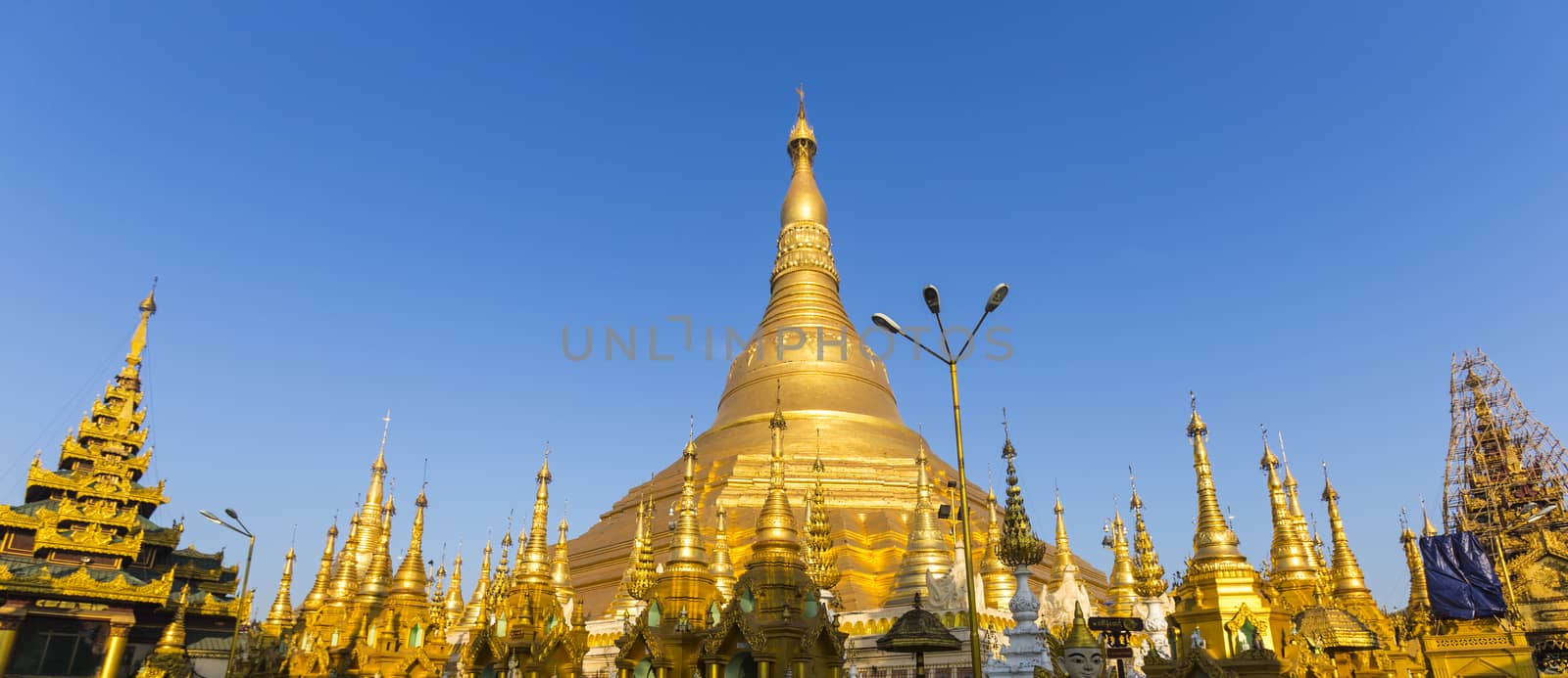 Panorama of Shwedagon pagoda with blue sky. Yangon. Myanmar or Burma.