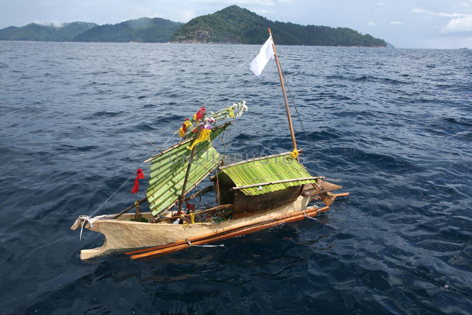 Craft boat floating in ceremony for respect to ancestor of Sea G by think4photop