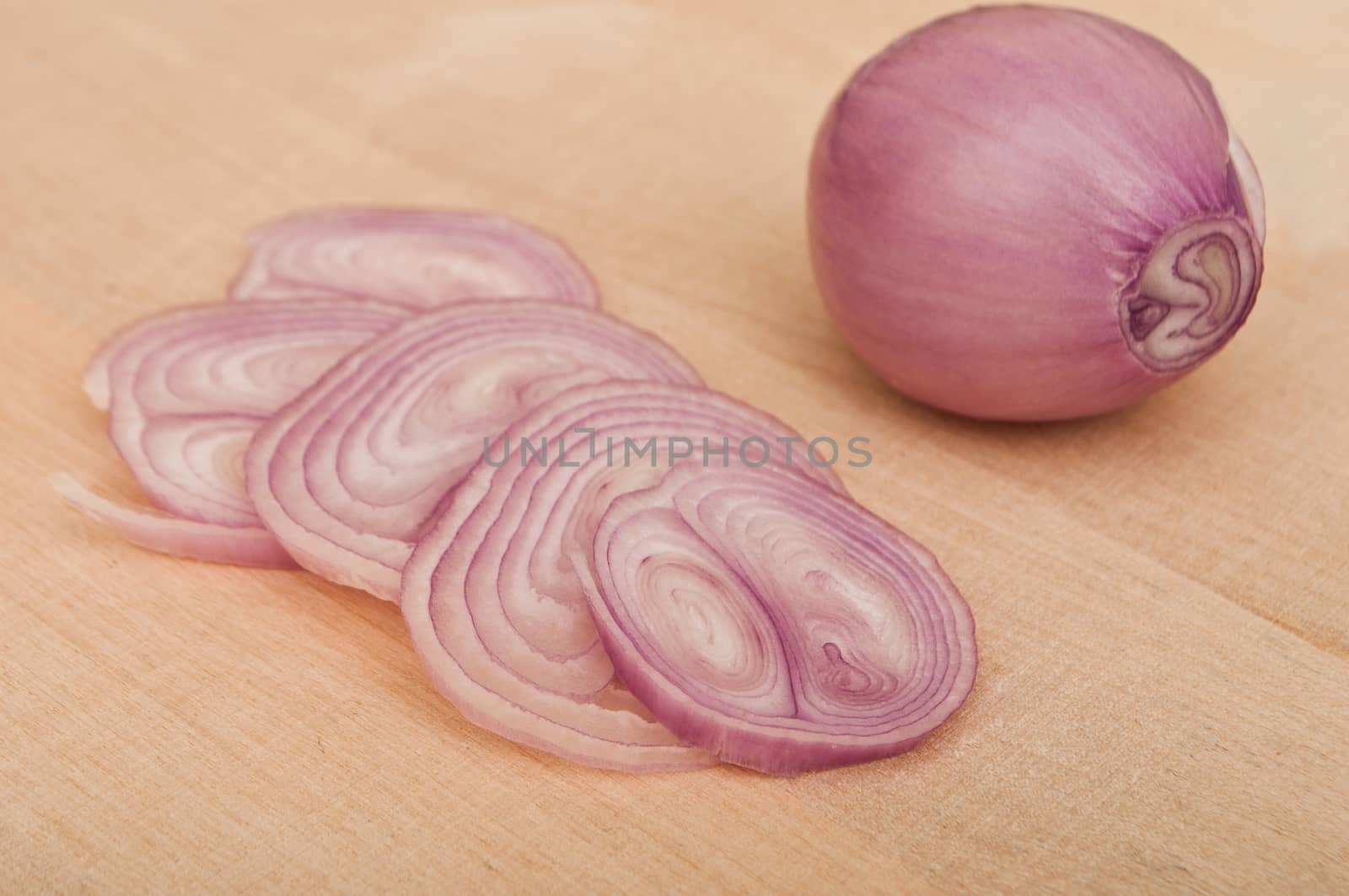 Shallot  peeled on wooden  background