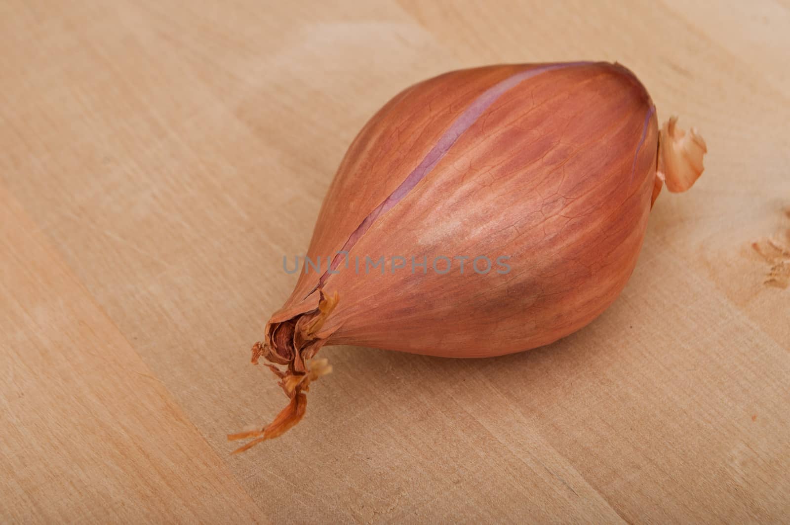 Shallot isolated on wooden  background