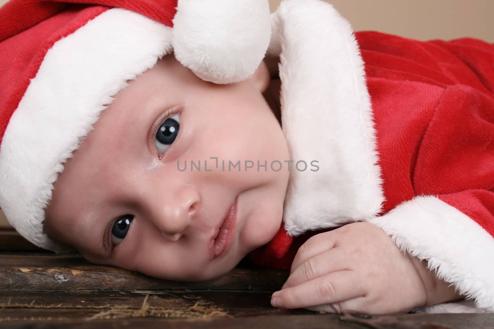 Cute baby boy wearing a christmas suit 