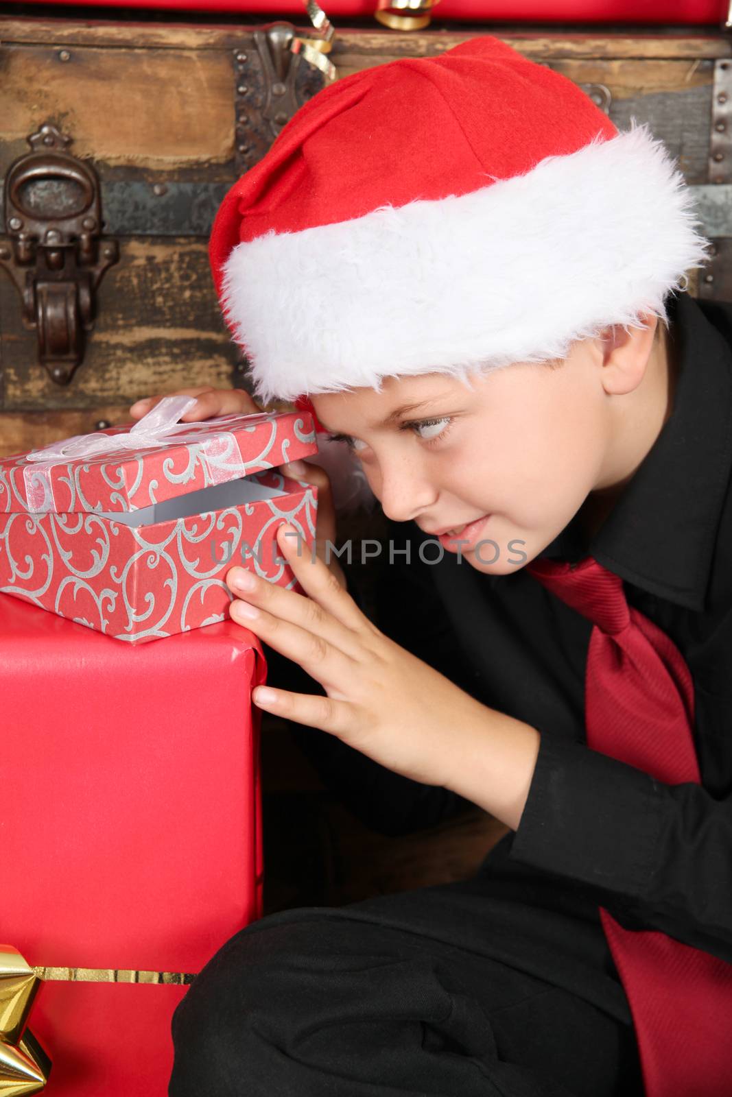 Young boy excited about finding out what his gift is