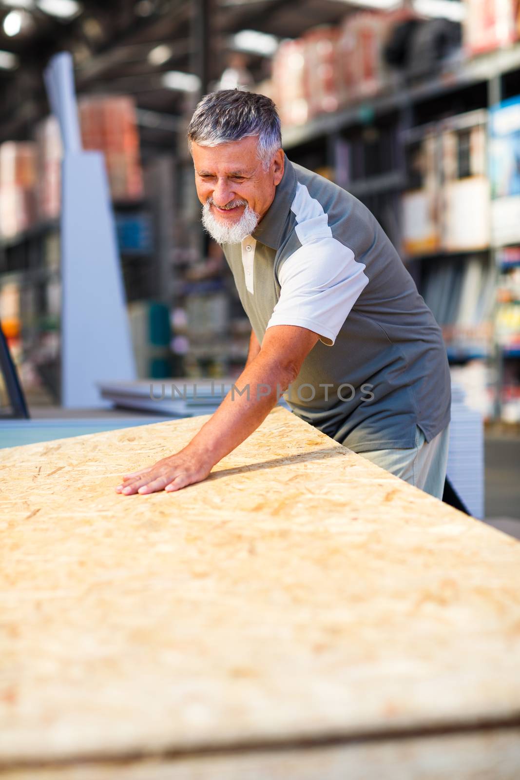 Man choosing and buying construction wood in a  DIY store by viktor_cap