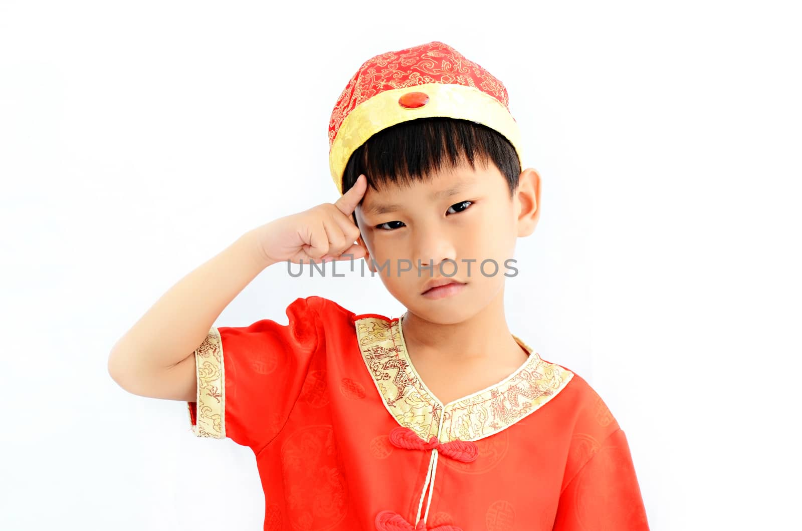 China boy in traditional Chinese red Tang suit greeting