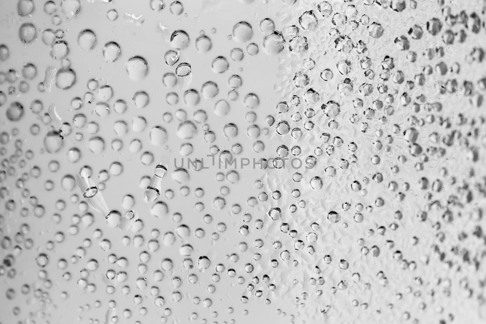 macro of sparkle water drops on dewy glass for background or backdrop