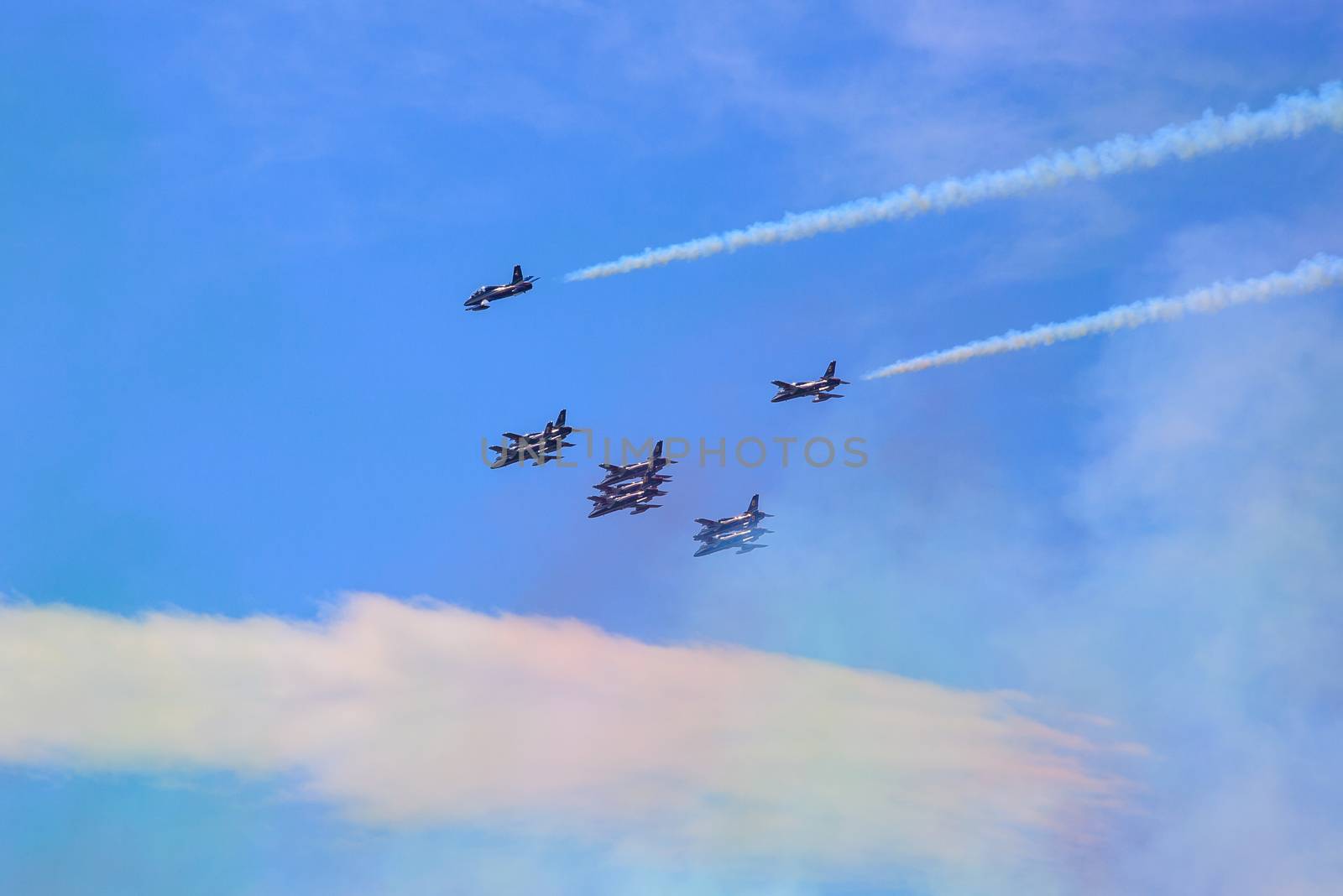 TRIESTE, ITALY - JUNE, 01: View of Italian military airplane called frecce tricolore "tricolor arrows" in acrobatics on June 01, 2014