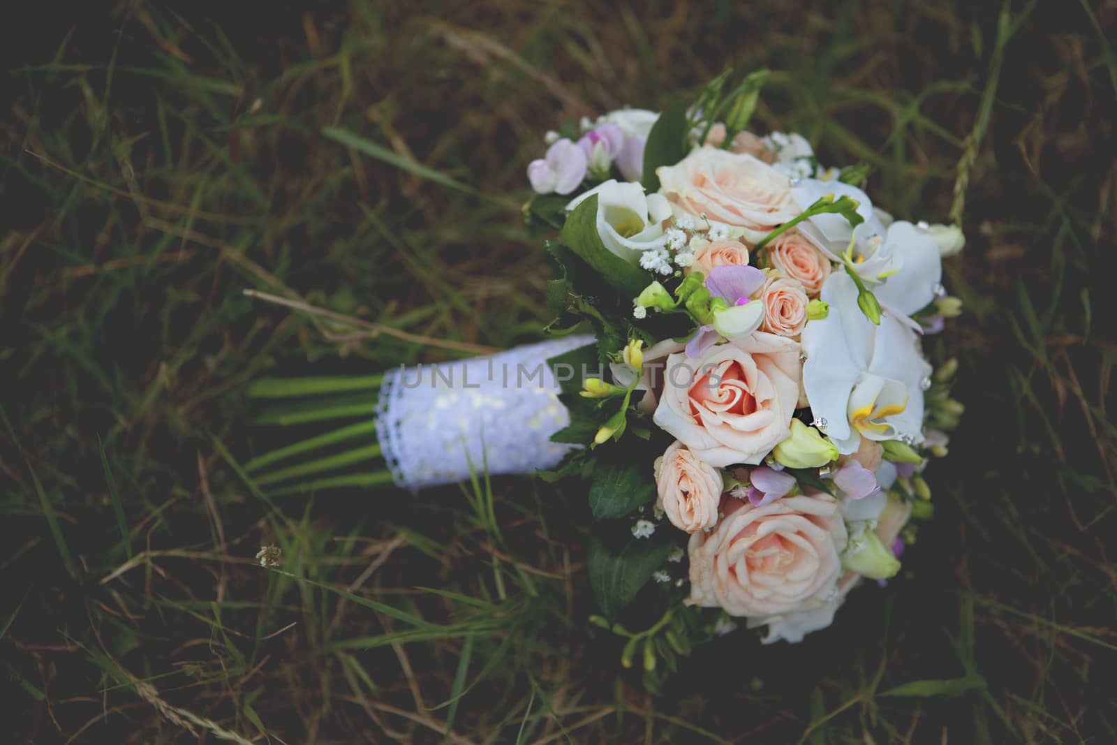 beautiful wedding flowers bouquet on the green grass
