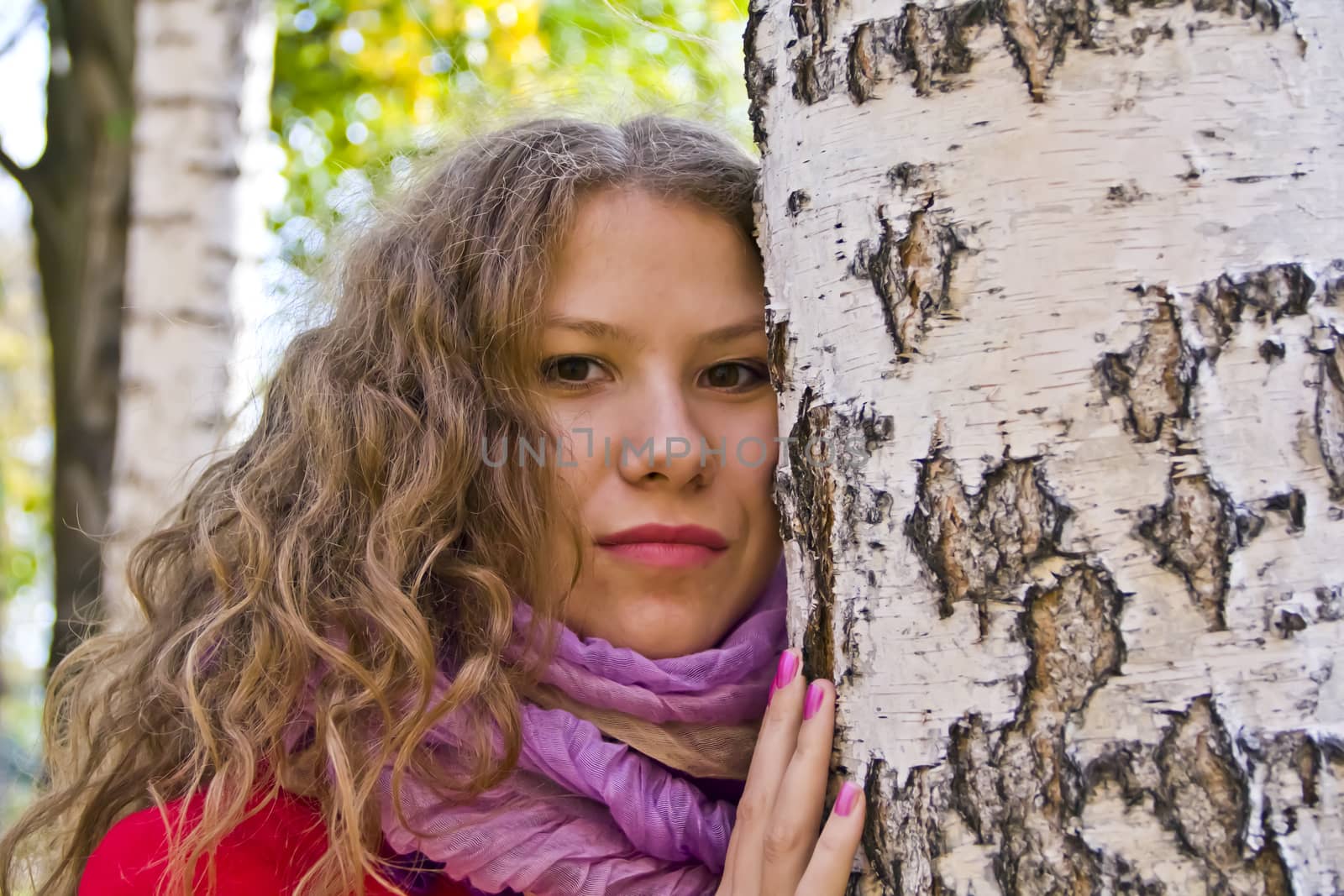 Photo of beautiful young woman in the autumn