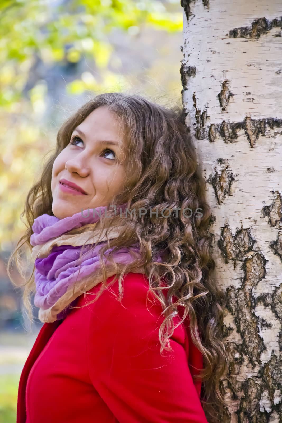 Photo of beautiful young woman in the autumn